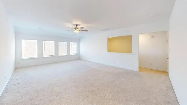 a view of an empty room with a window