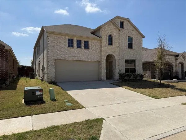 a front view of a house with parking space