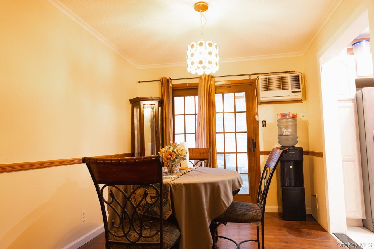 1322 Barry Drive South Valley Stream, NY 11580 - Photo 5 of 12 a view of a dining room with furniture and chandelier