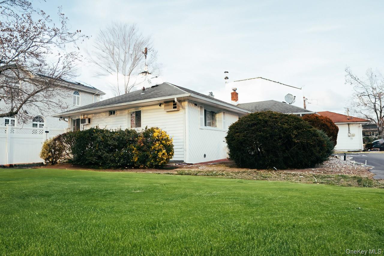 1322 Barry Drive South Valley Stream, NY 11580 - Photo 9 of 12 a view of front of house with a yard
