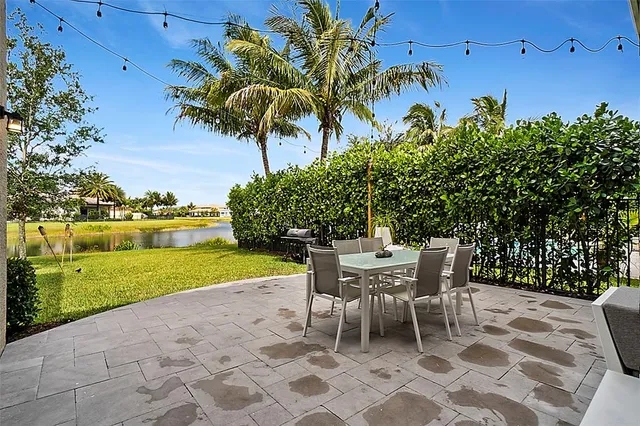 a view of a patio with a table and chairs