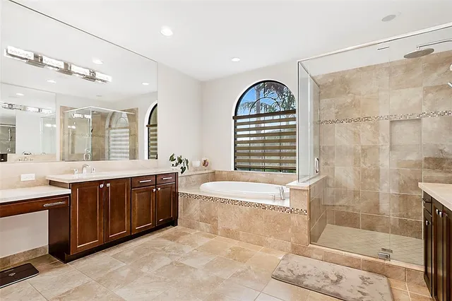 a bedroom with a bed dresser and a window