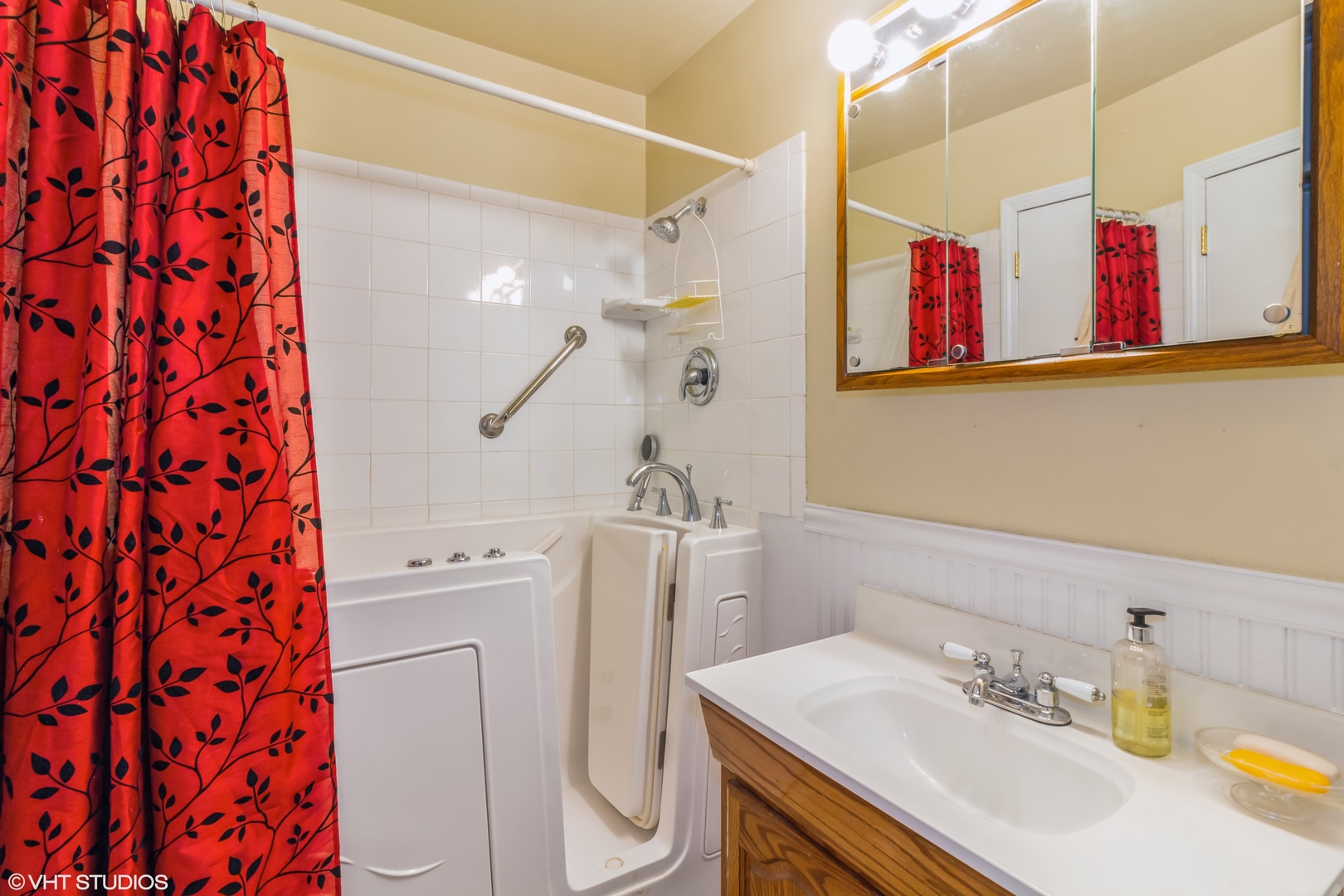 805 Cypress Lane Joliet, IL 60435 - Photo 8 of 10 a bathroom with a sink vanity mirror and toilet