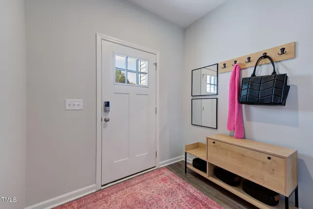 a bedroom with a bed and a mirror