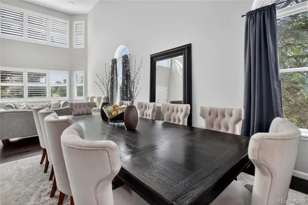 a living room with furniture rug and wooden floor