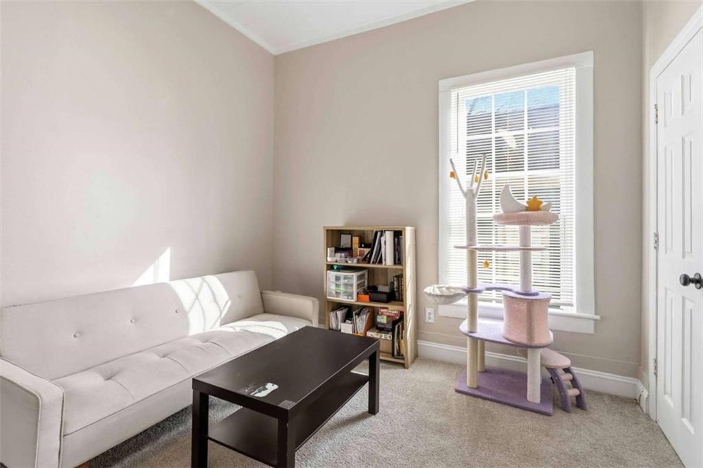 949 East Solomon Street Griffin, GA 30223 - Photo 12 of 26 a living room with furniture and a window