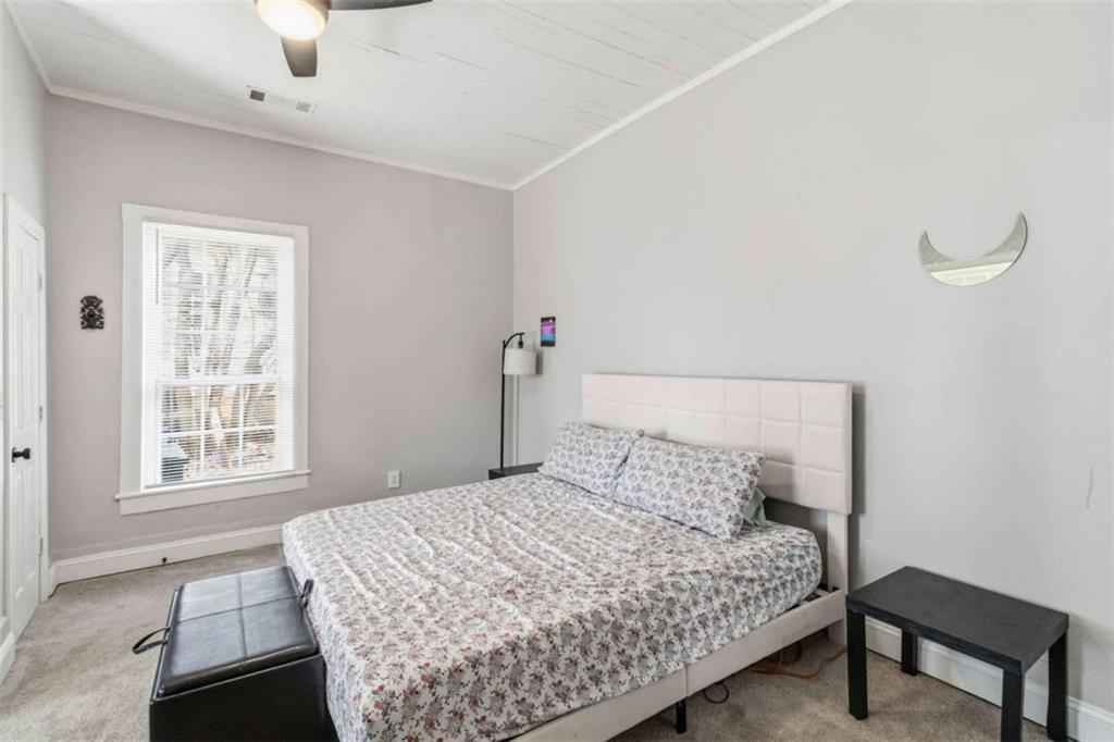 949 East Solomon Street Griffin, GA 30223 - Photo 18 of 26 a bedroom with a bed and a window