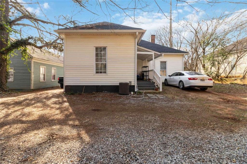 949 East Solomon Street Griffin, GA 30223 - Photo 21 of 26 a couple of cars parked in front of a house