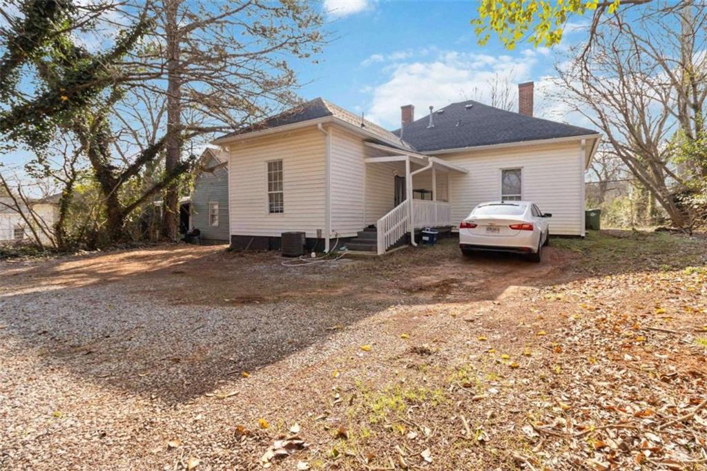 949 East Solomon Street Griffin, GA 30223 - Photo 22 of 26 a view of house with a yard