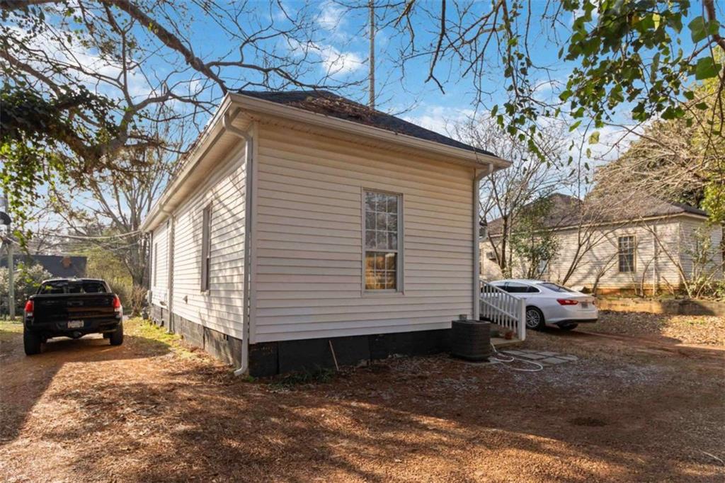 949 East Solomon Street Griffin, GA 30223 - Photo 24 of 26 a view of a house with a yard