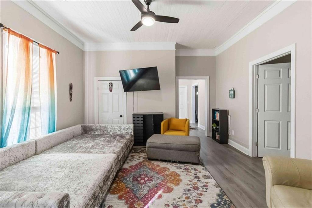 949 East Solomon Street Griffin, GA 30223 - Photo 7 of 26 a living room with fireplace furniture and a flat screen tv