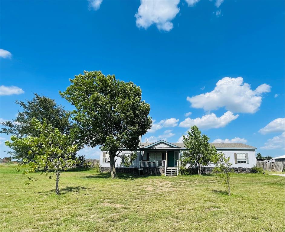 1100 Pecan Ridge Drive Venus, TX 76084 - Photo 4 of 13 View of grassy yard with covered porch