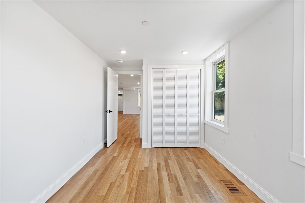 290 Washington Street, Unit 2 Marblehead, MA 01945 - Photo 12 of 25 a view of hallway with a large window and wooden floor