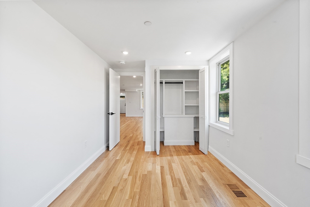 290 Washington Street, Unit 2 Marblehead, MA 01945 - Photo 13 of 25 a view of a room with wooden floor and a hallway