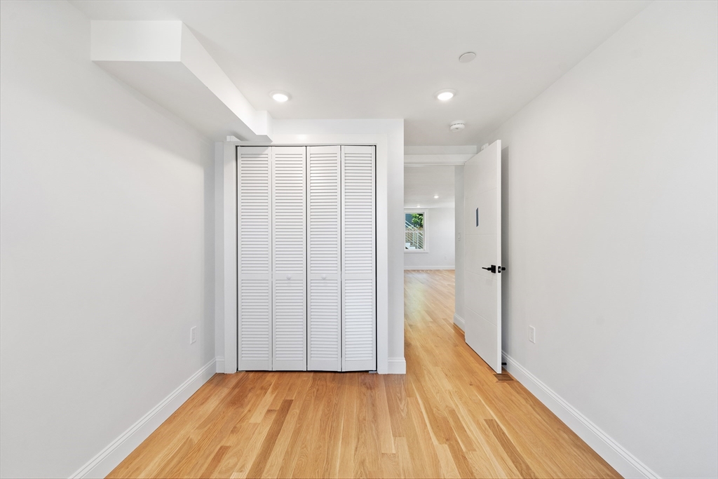 290 Washington Street, Unit 2 Marblehead, MA 01945 - Photo 15 of 25 a view of a hallway with wooden floor