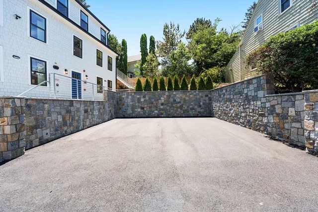 a view of a brick house with a large window