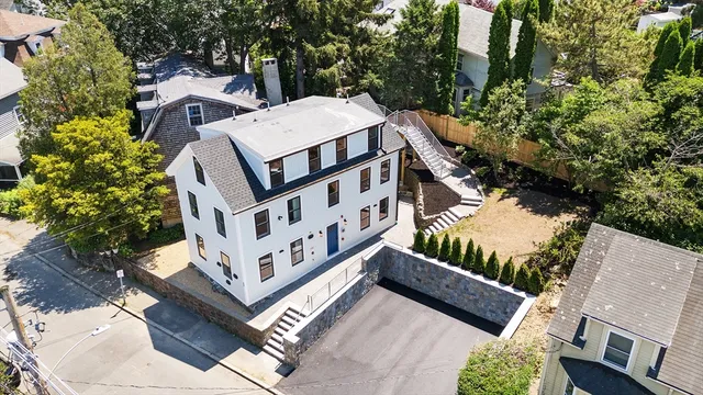 a front view of a building with large windows