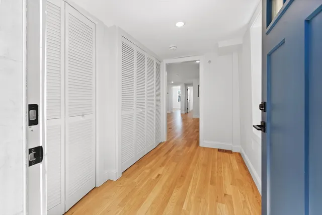 a view of a room with wooden floor