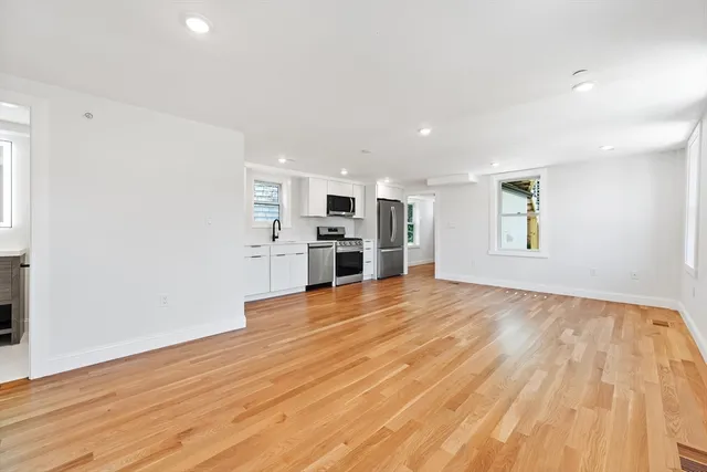 a view of a kitchen with a sink and a stove top oven