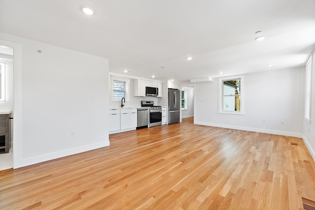 290 Washington Street, Unit 2 Marblehead, MA 01945 - Photo 8 of 25 a view of a kitchen with a sink and a stove top oven