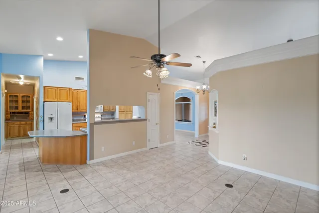 a kitchen with stainless steel appliances a refrigerator sink and cabinets