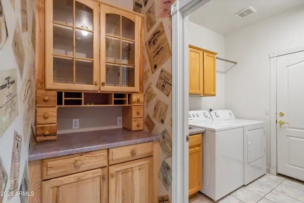 a bathroom with a double vanity sink mirror and