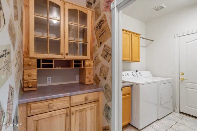 a bathroom with a double vanity sink mirror and