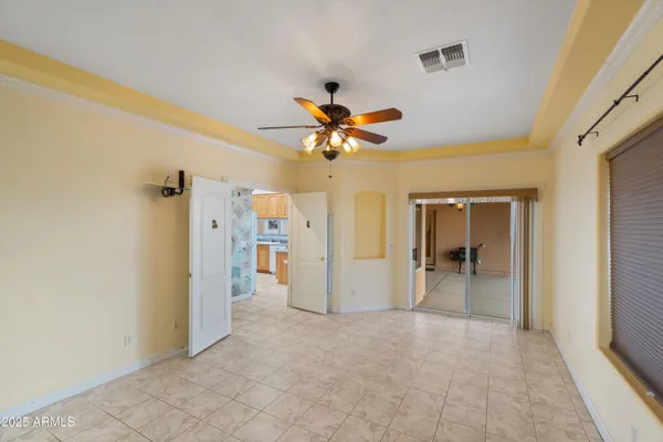 a view of room with window and ceiling fan