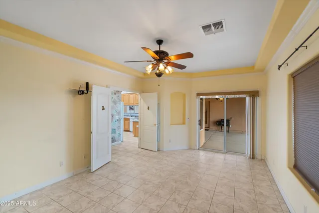 a view of room with window and ceiling fan