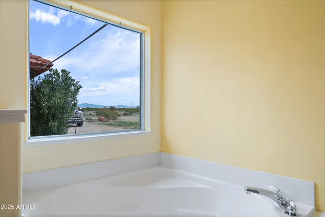 a view of a lake with beach and mountain view