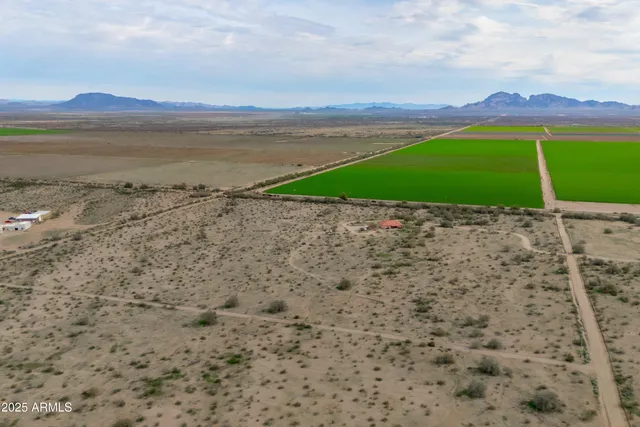 a view of an ocean beach and mountain