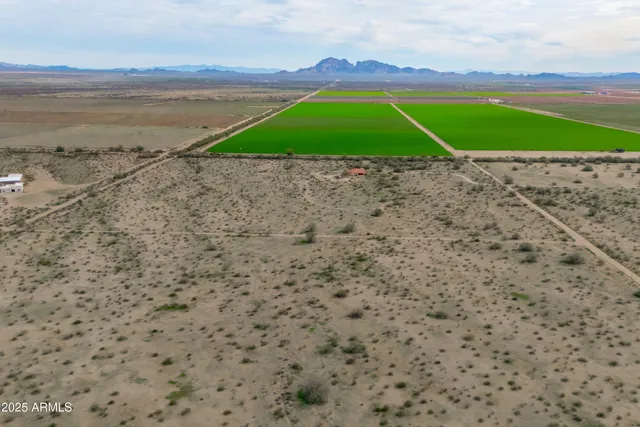 a view of a house with pool and a fire pit