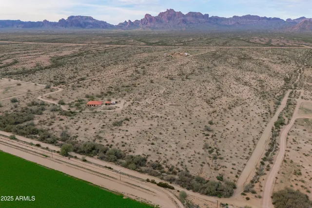 a view of mountain with a forest