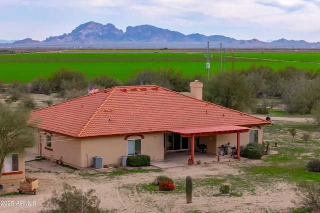 a view of a lake with furniture and city view