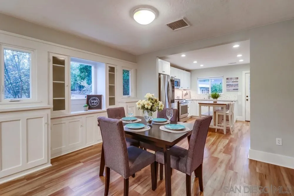 11461 Posthill Place Lakeside, CA 92040 - Photo 12 of 46 a view of a dining room with furniture window and wooden floor