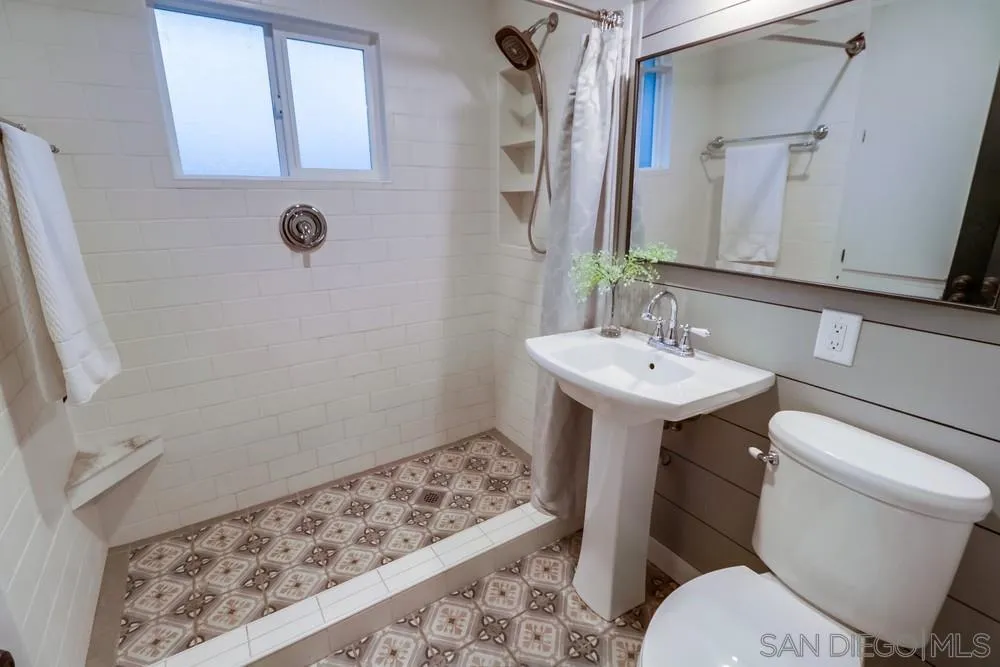 11461 Posthill Place Lakeside, CA 92040 - Photo 22 of 46 a bathroom with a sink toilet and shower