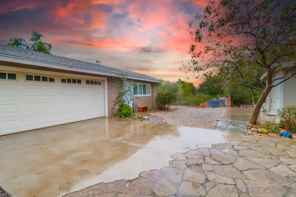 11461 Posthill Place Lakeside, CA 92040 - Photo 29 of 46 a front view of a house with a yard and garage