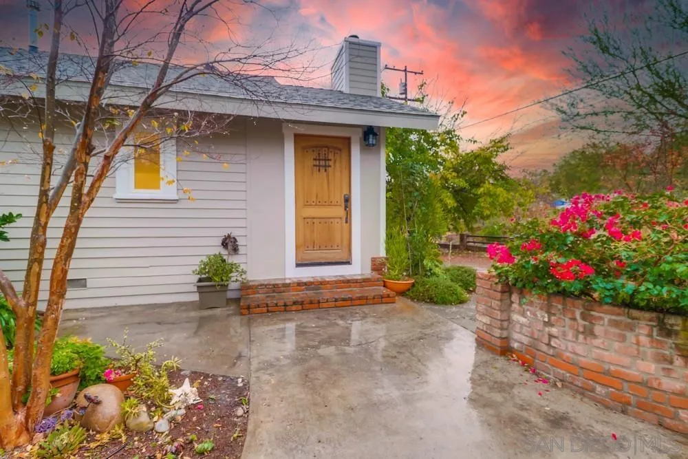 11461 Posthill Place Lakeside, CA 92040 - Photo 4 of 46 a front view of a house with a yard