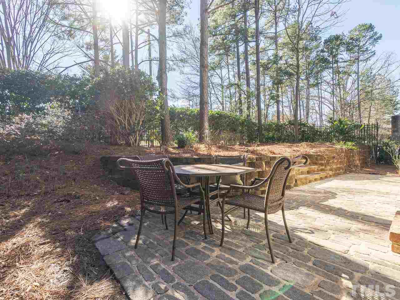 2267 Clayette Court Raleigh, NC 27612 - Photo 28 of 29 a view of a patio with table and chairs and couches