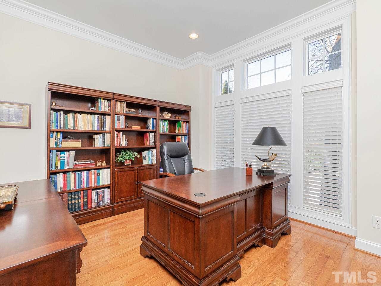 2267 Clayette Court Raleigh, NC 27612 - Photo 7 of 29 a room with furniture and a book shelf