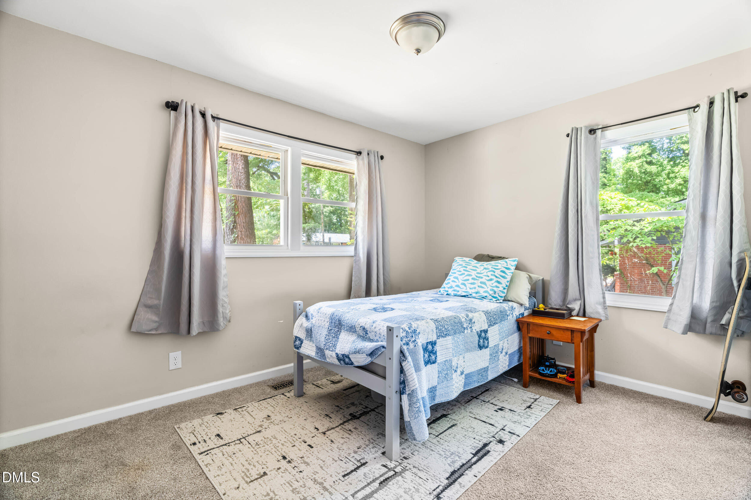3724 Randell Road Garner, NC 27529 - Photo 23 of 32 a bedroom with a bed and a window