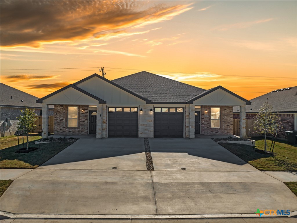 5104 Rose Gdn Loop Killeen, TX 76542 - Photo 1 of 27 a front view of a house with a yard