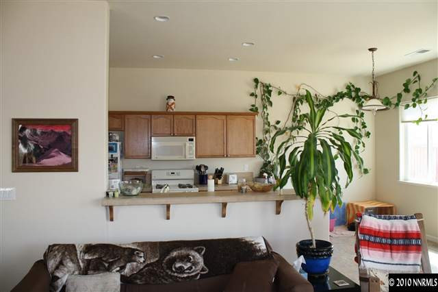 1640 Murrieta Court Reno, NV 89521 - Photo 3 of 9 a kitchen with a refrigerator and a stove