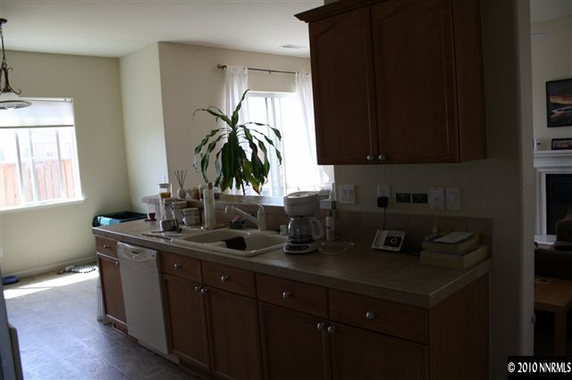 1640 Murrieta Court Reno, NV 89521 - Photo 4 of 9 a kitchen with stainless steel appliances a sink a counter space and a window