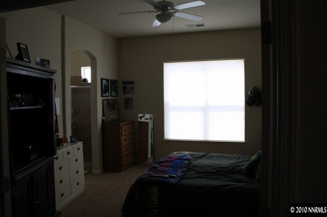 1640 Murrieta Court Reno, NV 89521 - Photo 5 of 9 a bedroom with a bed and a window