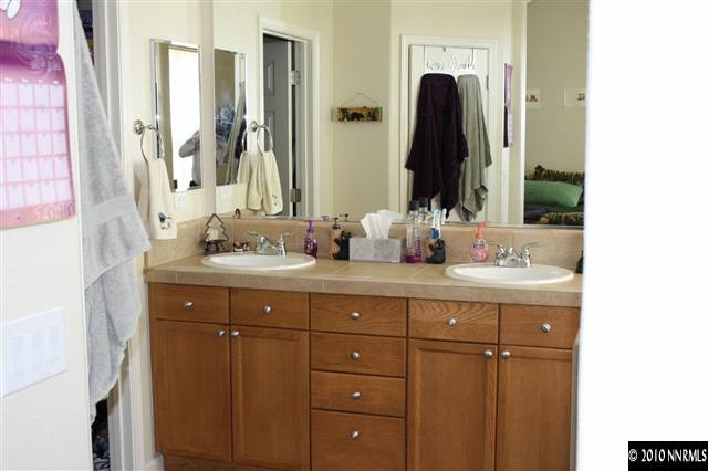 1640 Murrieta Court Reno, NV 89521 - Photo 6 of 9 a bathroom with a double vanity sink and a mirror