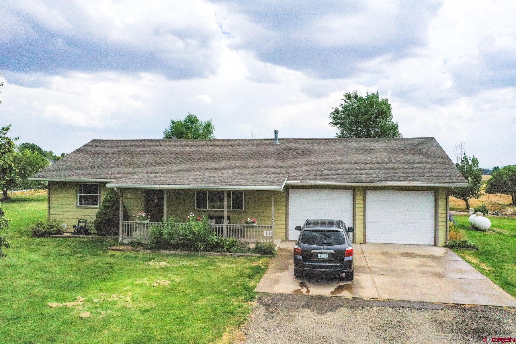 25548 Rd N 6 Loop Cortez, CO 81321 - Photo 2 of 35 a front view of a house with a garden