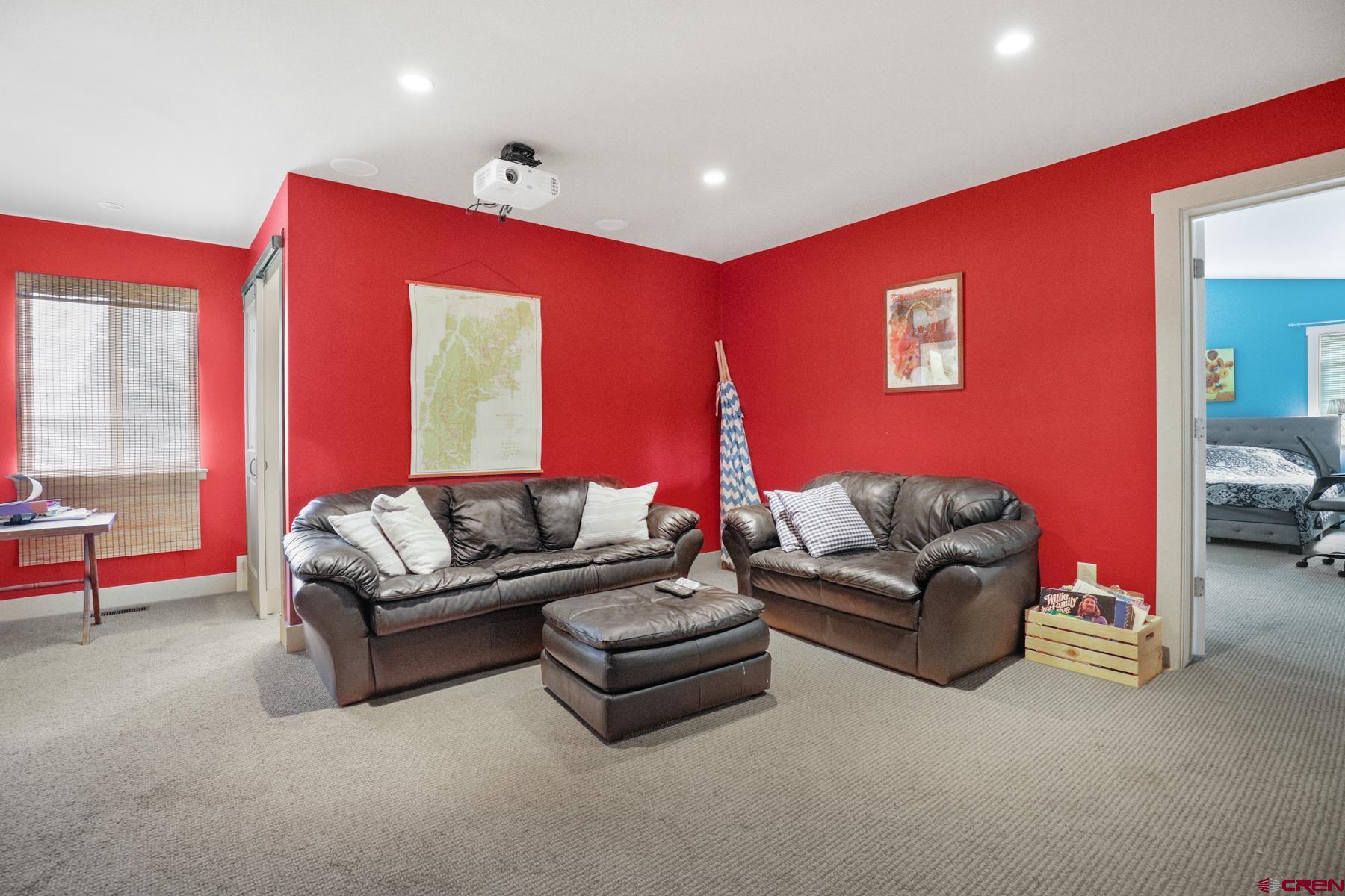 25548 Rd N 6 Loop Cortez, CO 81321 - Photo 21 of 35 a living room with furniture and a large window