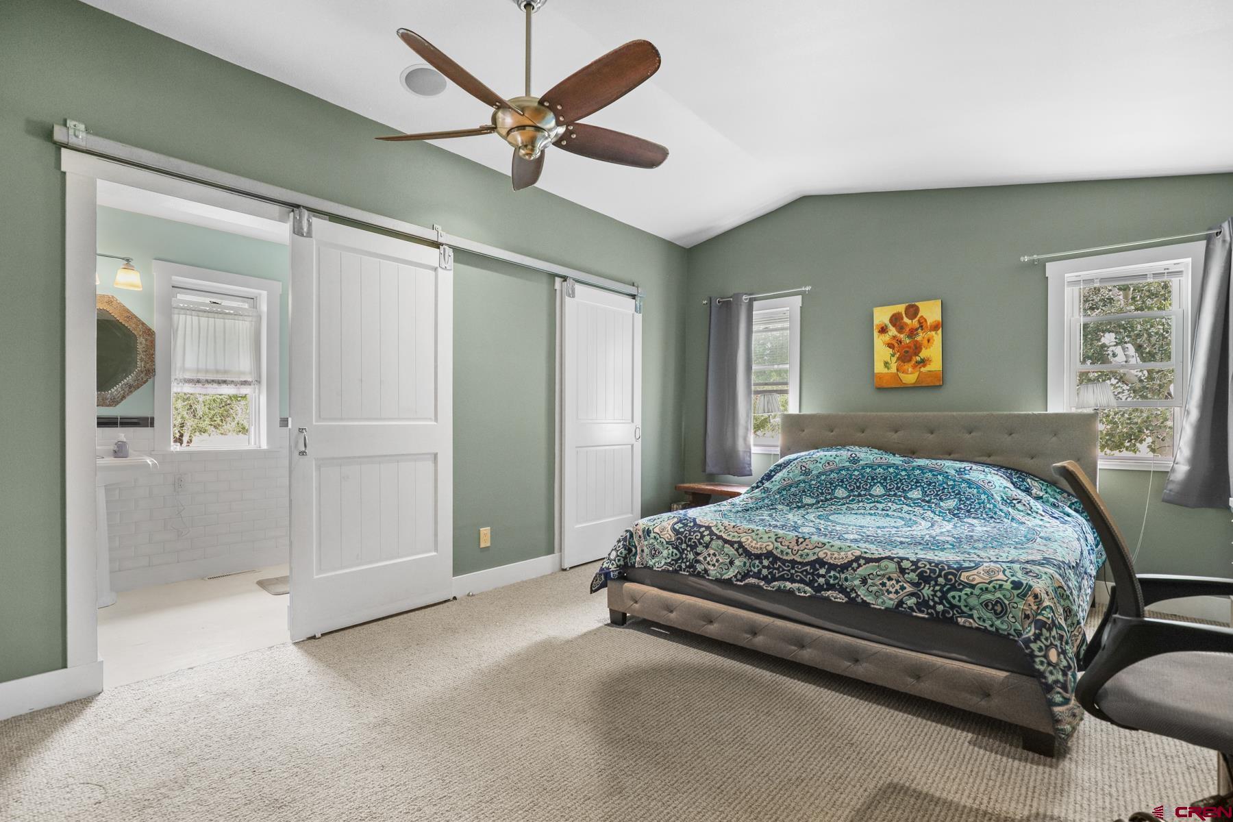 25548 Rd N 6 Loop Cortez, CO 81321 - Photo 33 of 35 a bedroom with a bed and a chandelier