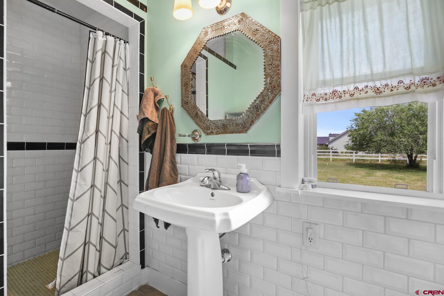 25548 Rd N 6 Loop Cortez, CO 81321 - Photo 34 of 35 a bathroom with a sink and a mirror